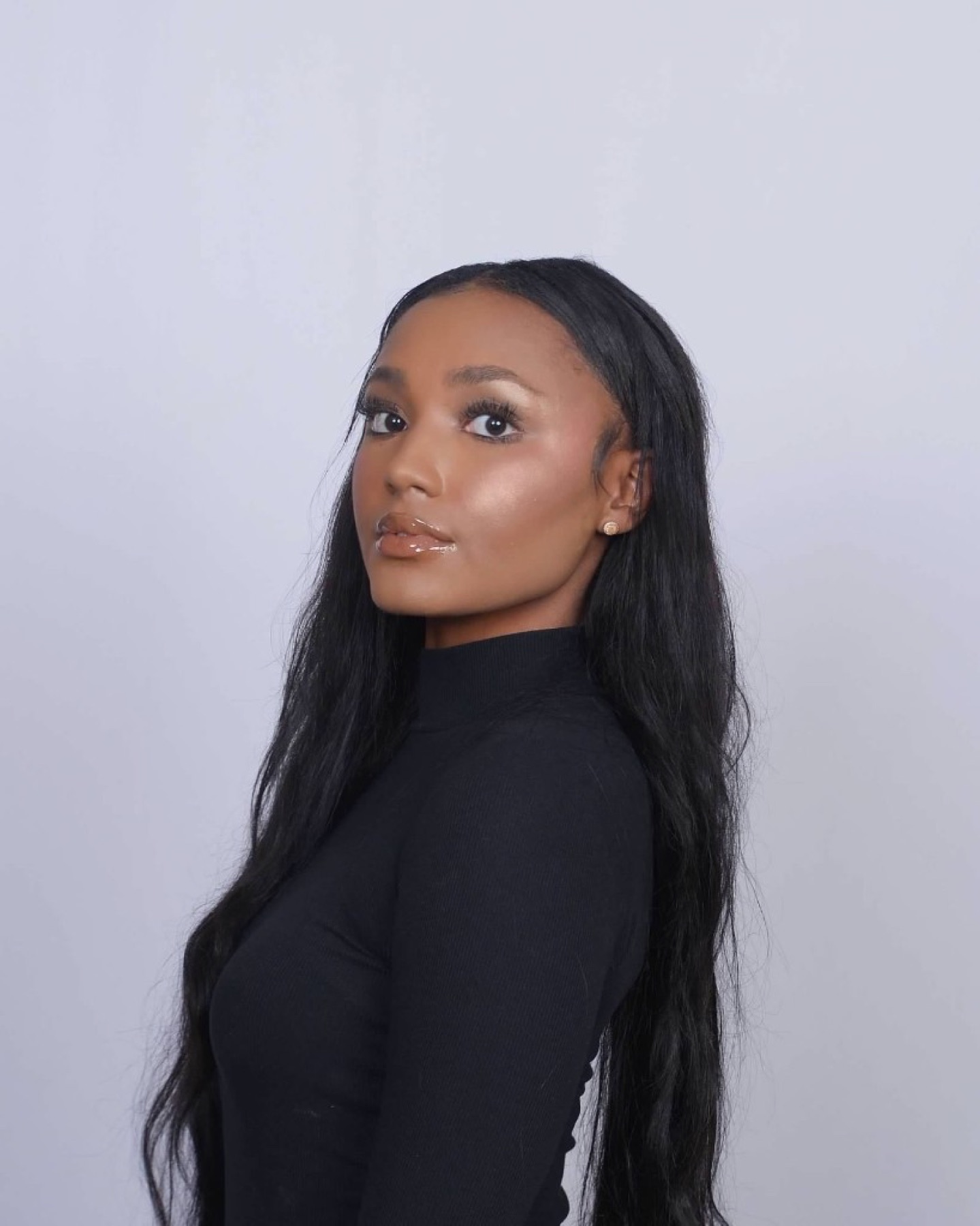 Marissa Curry, studio portrait in black turtleneck